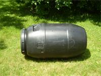 A tumbling 55 gallon plastic barrel