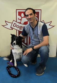 Dr. Amir with his black and white dog