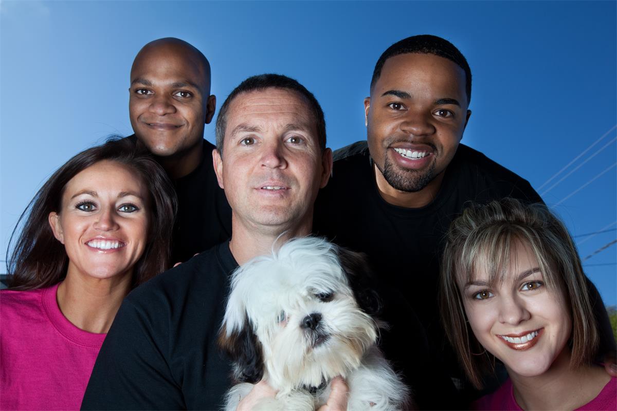 Happy healthy people and their pet dog