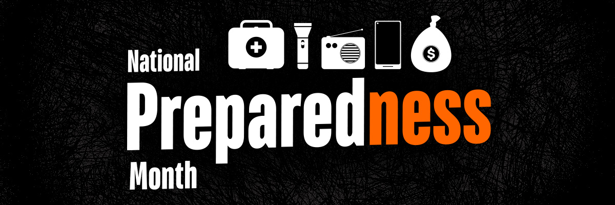 Graphic with a black background and the words 'National Preparedness Month' in white and orange text. Above the text are six white icons: a first aid kit, flashlight, radio, smartphone, and money bag. The word 'Preparedness' is bold, with the letters 'ness' highlighted in orange.