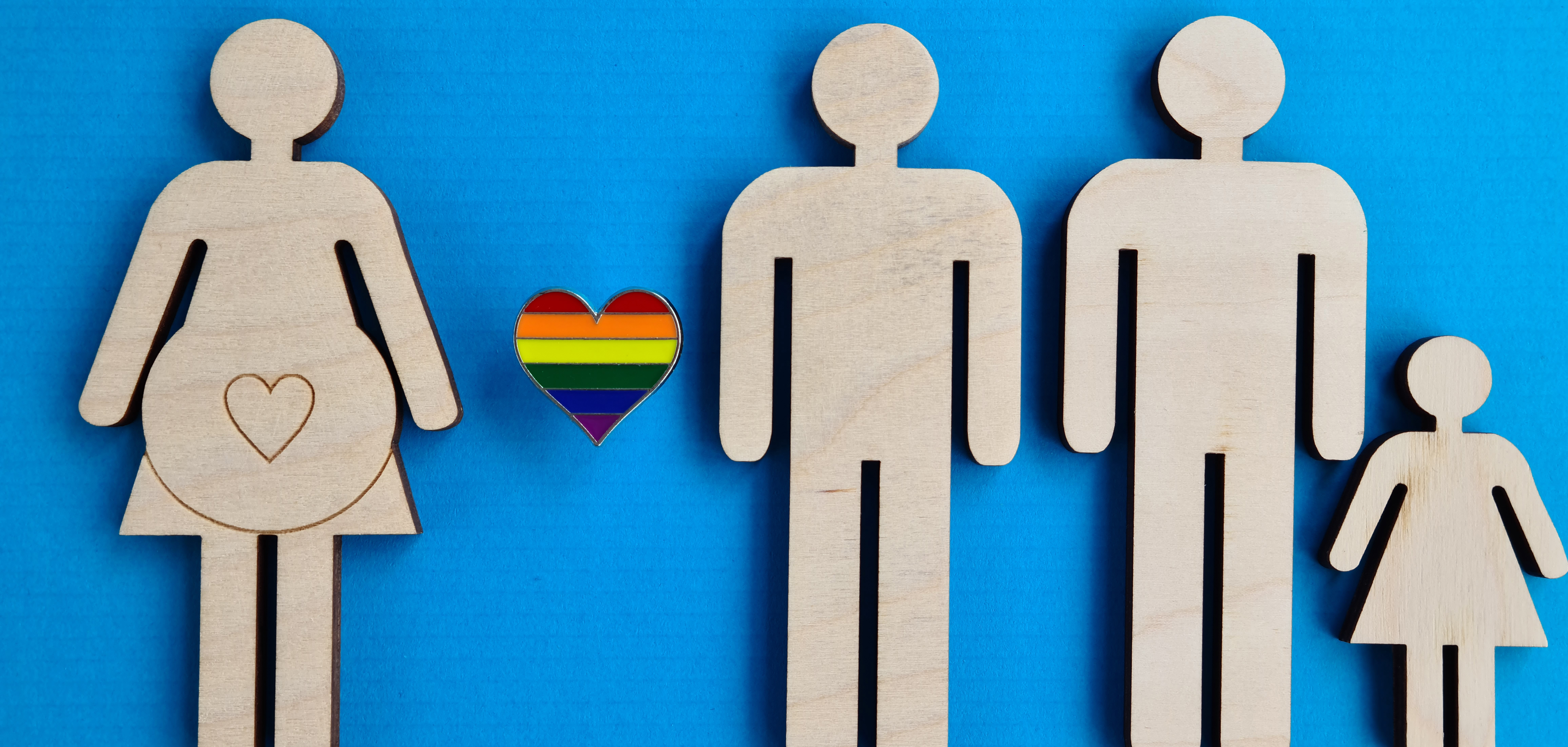 Individual looking straight into the camera with a distressed pose as both hands grasp the head