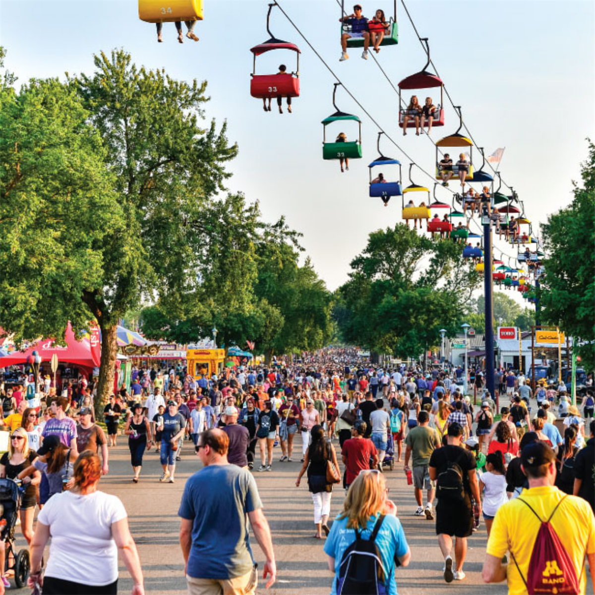 Image of the Minnesota State Fair with a crowd of people under a skyway