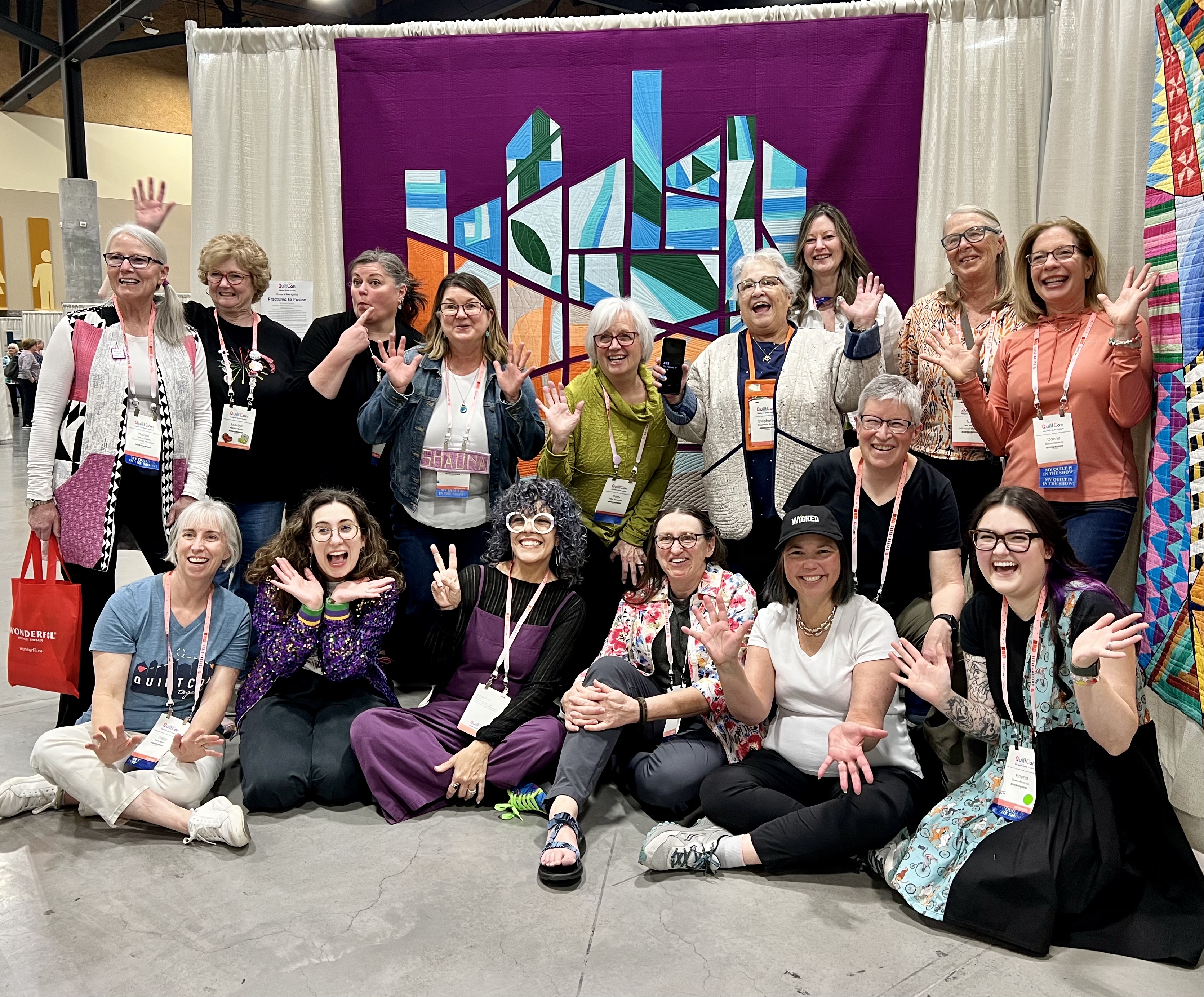 Modern Fusion in front of their Community quilt