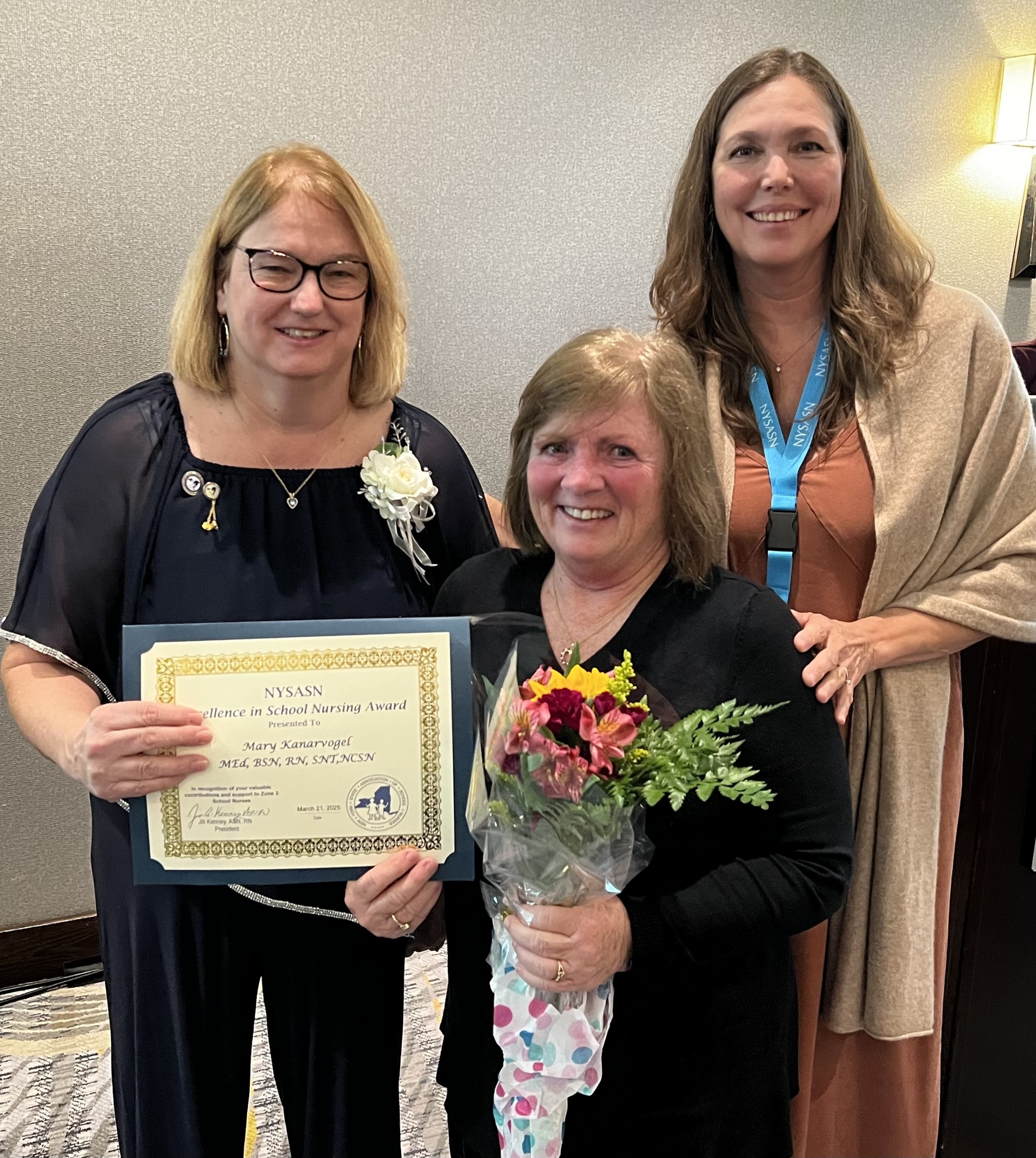 Excellence in School Nursing Winner Mary Kanarvogel with Zone 2 Rep Monica Valestrand and President Jill Kenney