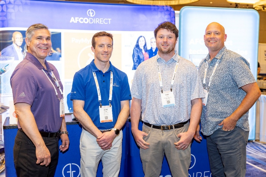 A group of men standing in front of a sign

AI-generated content may be incorrect.