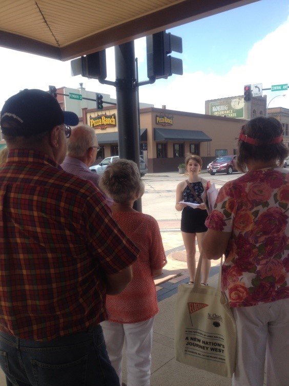 Youth on Main Street member, Shannon Robins, sharing stories during a downtown architectural and historical walking tour. Youth on Main Street member, Shannon Robins, sharing stories during a downtown architectural and historical walking tour.