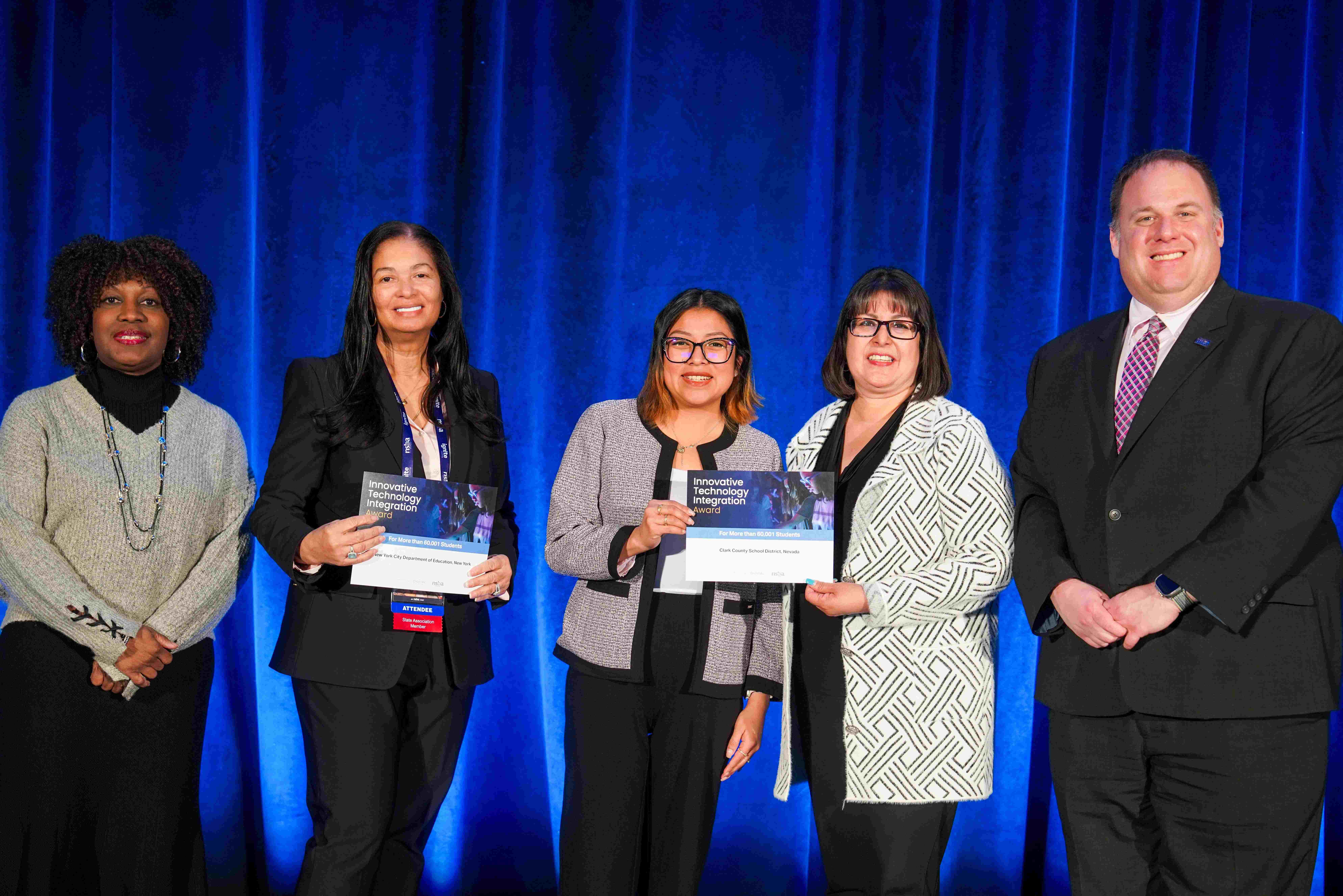 Award recipients hold the certificates they received for technology innovation.