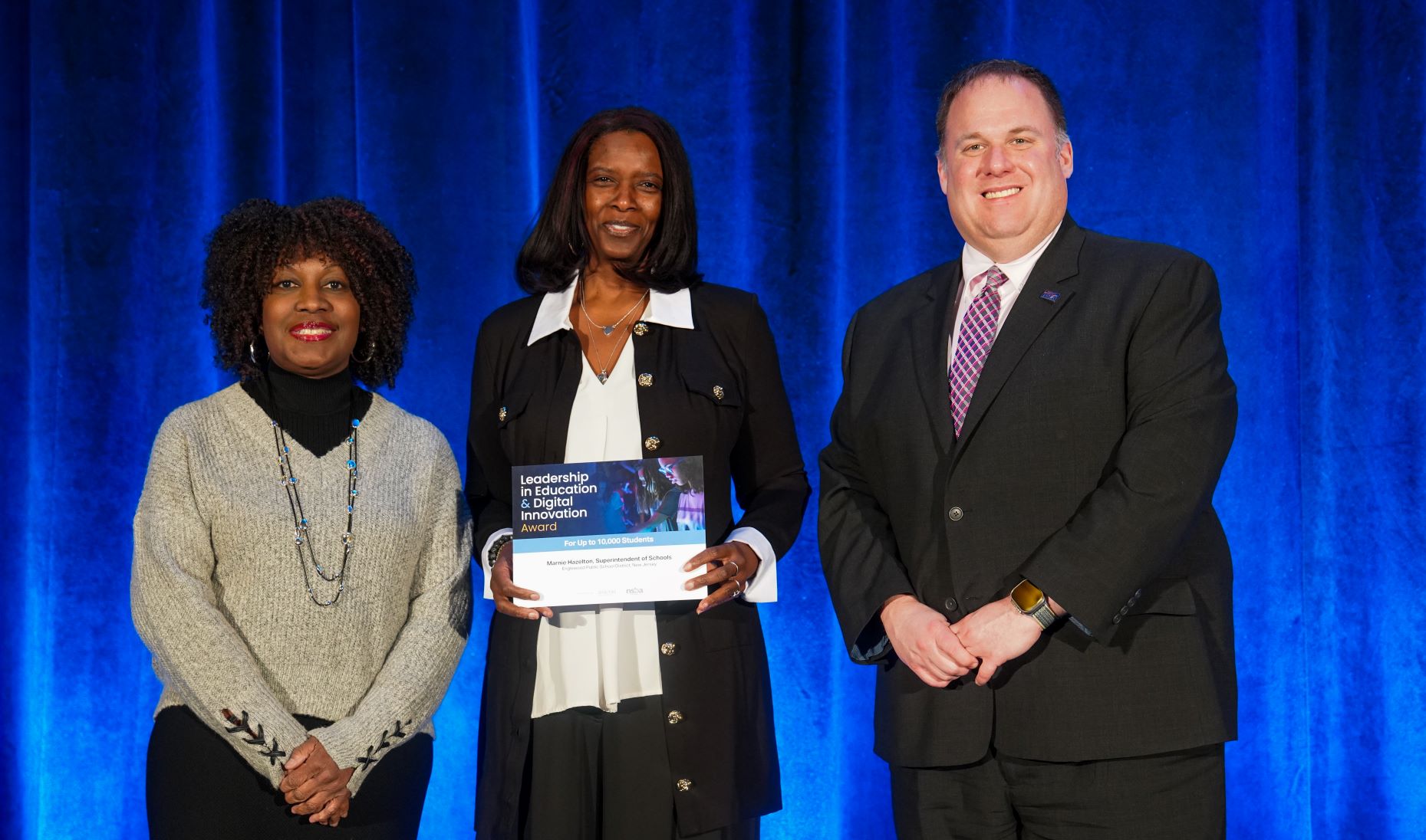 Dr. Marnie Hazelton with NSBA Executive Director Verjeana McCotter-Jacobs and NSBA President Devin Sheehan