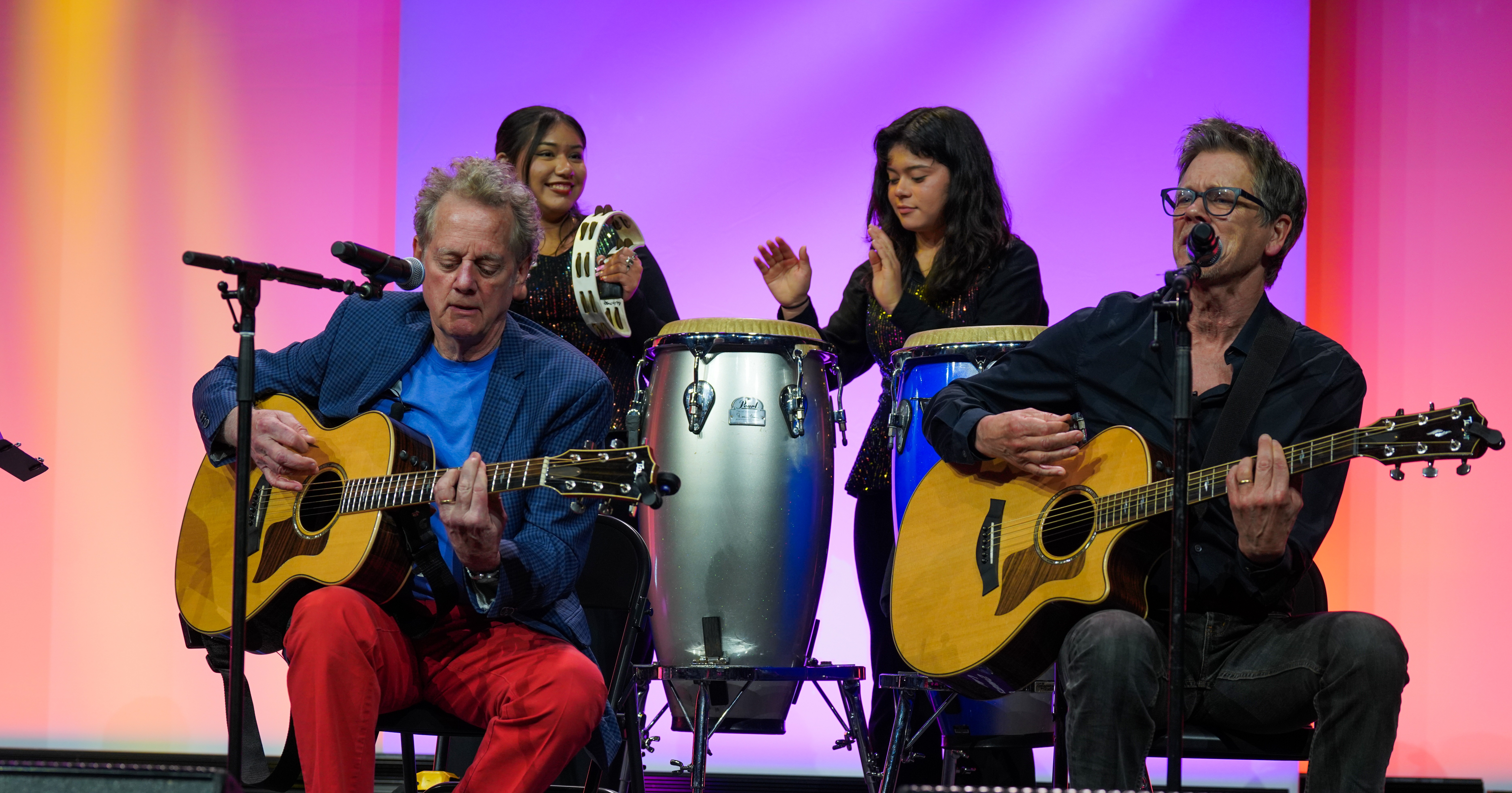 The Bacon Brothers performing at NSBA's 2025 Annual Conference with two students