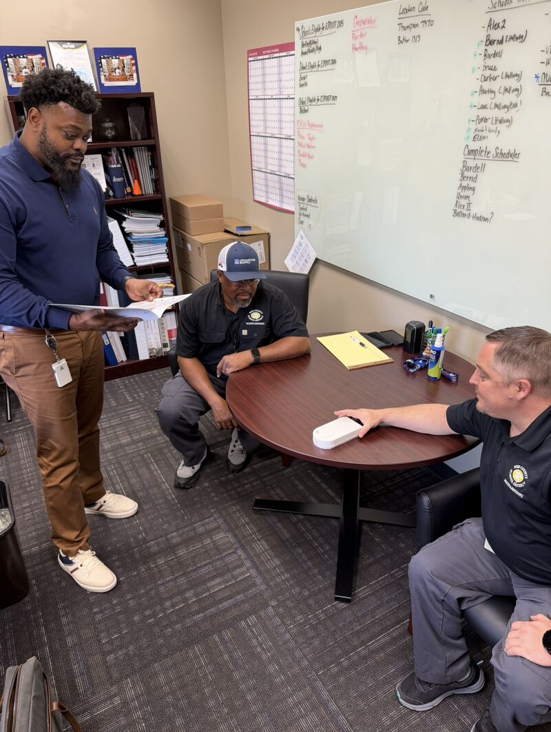 Individuals monitor an air-quality gauge