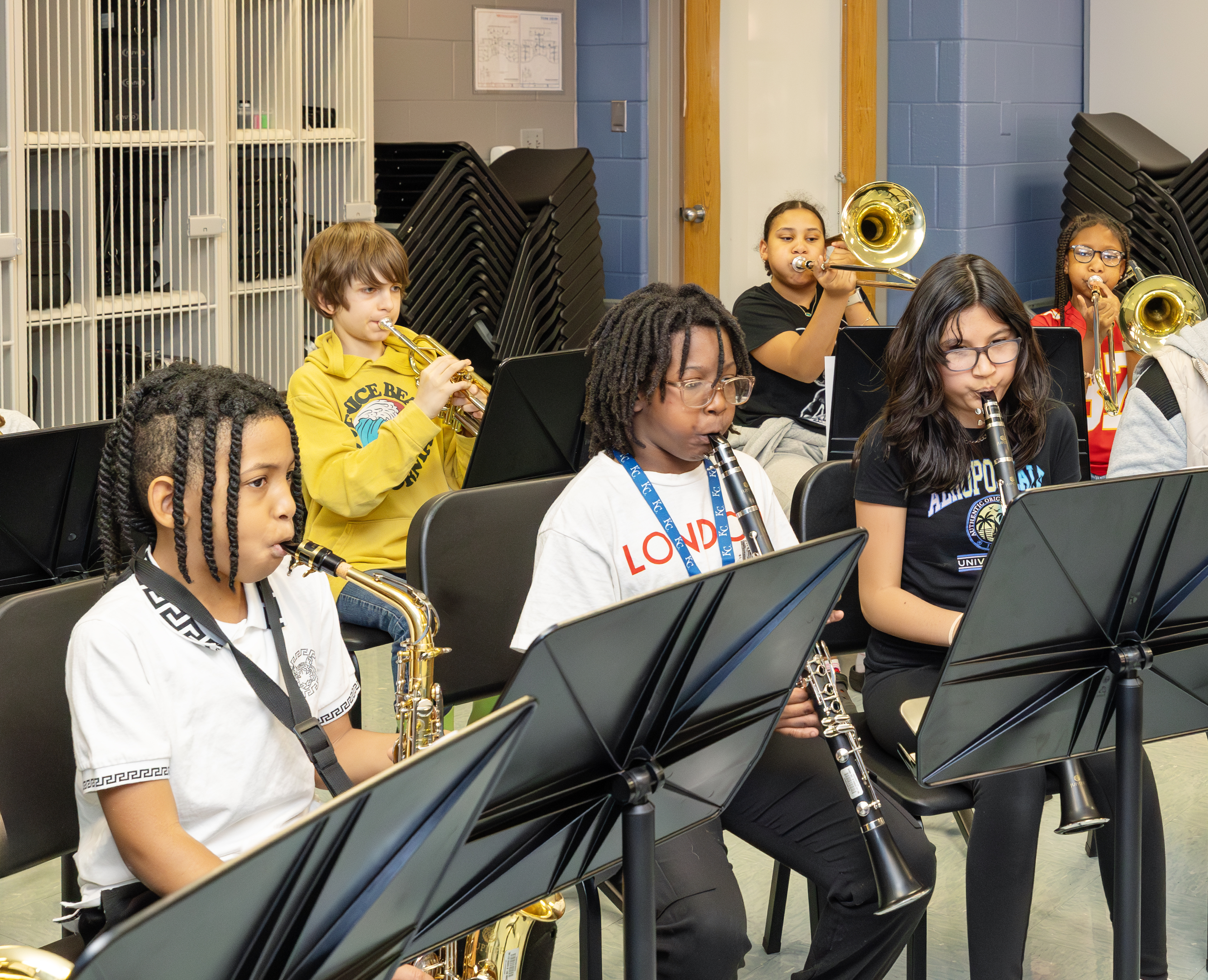 Elementary-age students participate in an instrumental music class.