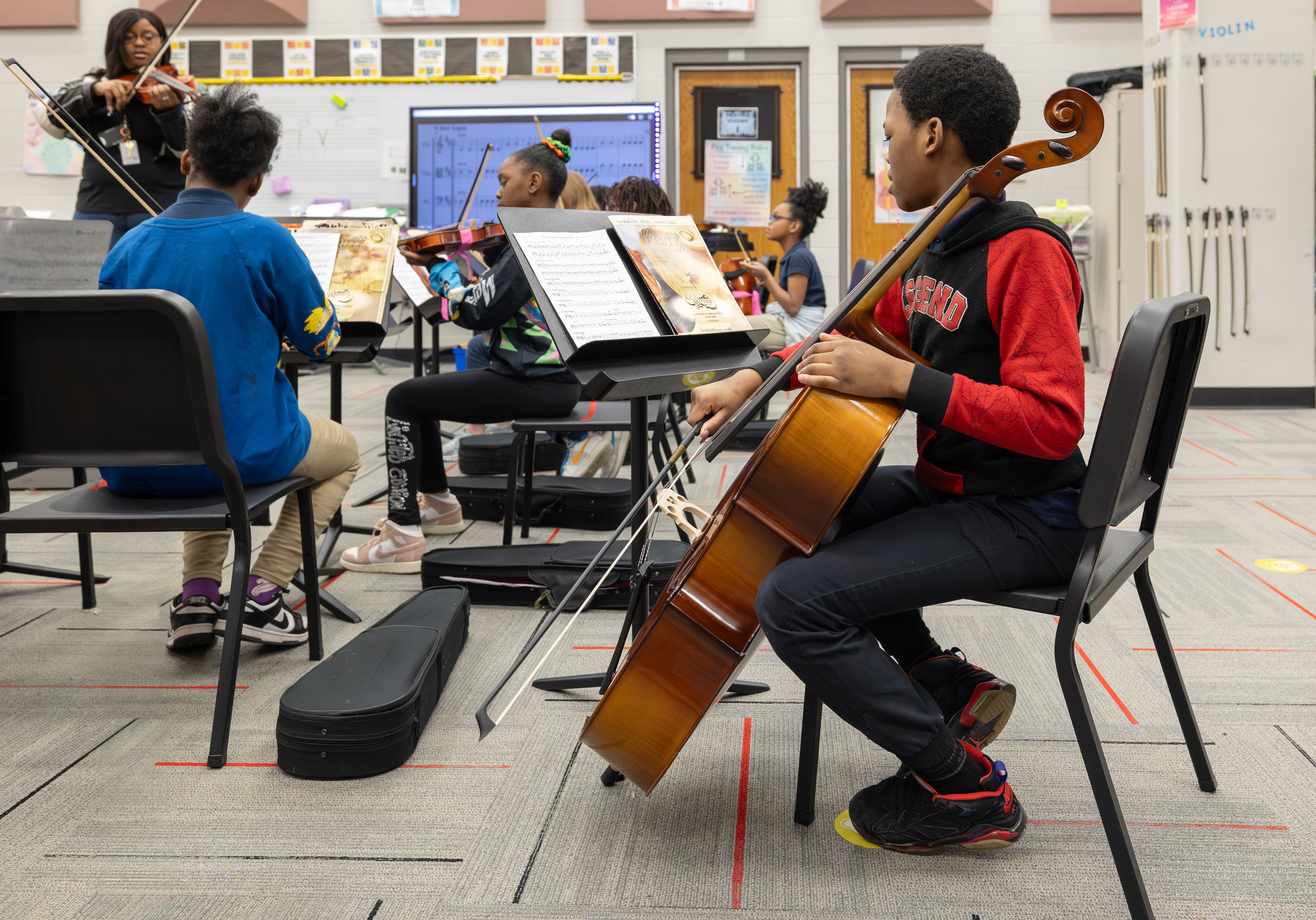 Elementary school students play instruments in an instrumental music class