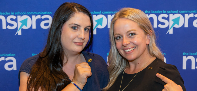 two female APR earners smile at camera