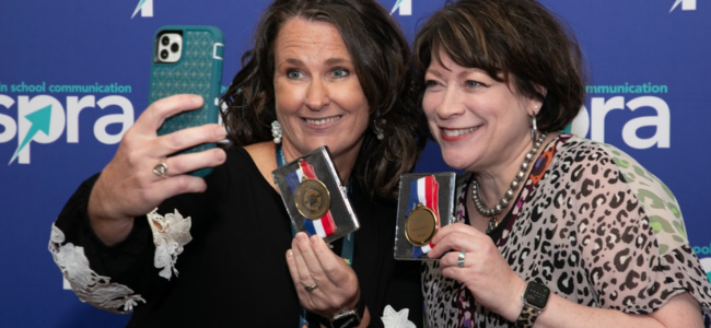 two female gold medallion award winners take a selfie