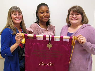 Eta Eta members Norma Beyer, Caramie Tshimanga, and Susan Bare display our sixth Chapter Key Award. 002_crop_3x4_400.jpg