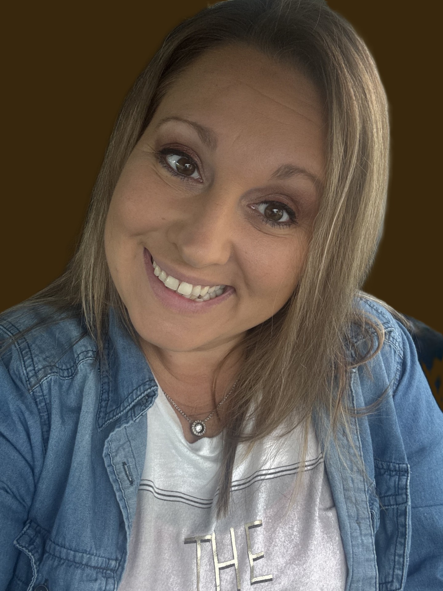 A close-up selfie of Jenny Stone. She is smiling broadly at the camera.