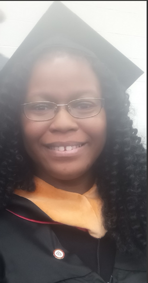 A person wearing a graduation cap and glasses

AI-generated content may be incorrect.