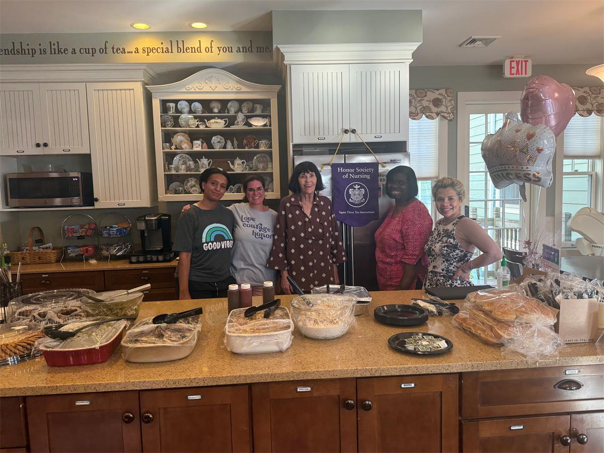 Tau Kappa at Large Chapter members gathered in the kitchen of the Ronald McDonald House of Albany after preparing and serving a community dinner for families on August 8, 2025.