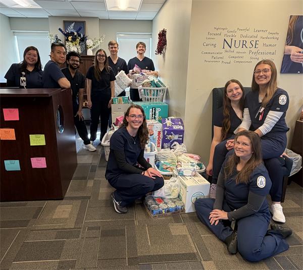 Psi Xi Members and the Accelerated Nursing Students collected diapers and feminine products for those in need.