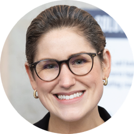 A person wearing glasses and smiling

AI-generated content may be incorrect.