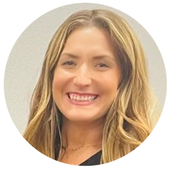 A person smiling at camera

Description automatically generated