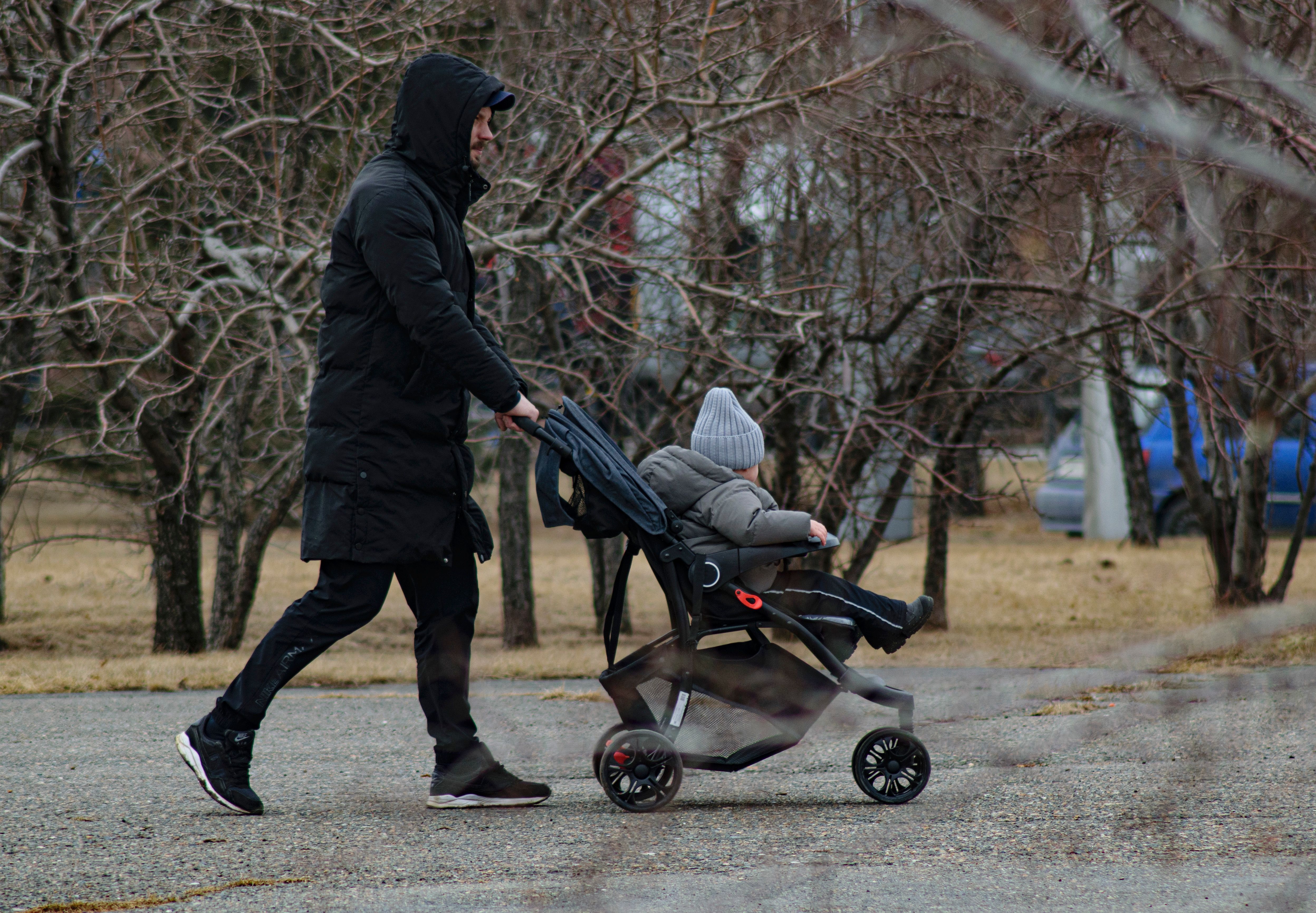 Photo by Radik 2707: https://www.pexels.com/photo/father-and-son-on-walk-in-park-11701191/