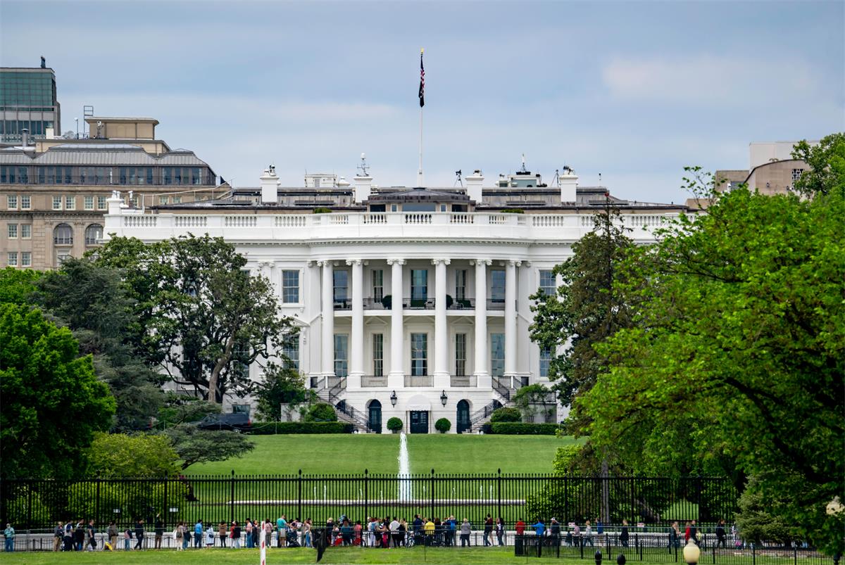 The White House in Washington, DC with tourists standing in front