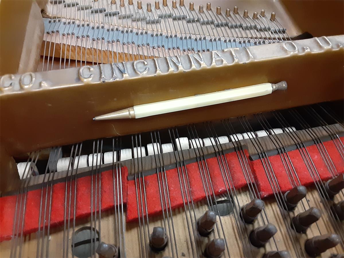 An ancient mechanical pencil with telephone dialer and internal magnet