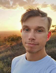A person taking a selfie
Description automatically generated