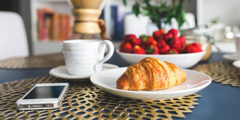 Croissant Breakfast table with croissant and coffee