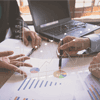 Exit strategy Two professionals looking at charts