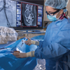 Woman IR performing procedure Woman IR performing procedure