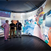 Medical professionals looking at procedure on giant screen Medical professionals looking at procedure on giant screen