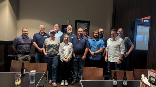 A group of people standing together
AI-generated content may be incorrect.