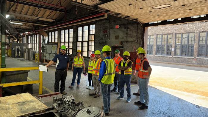 A group of people in a building
AI-generated content may be incorrect.