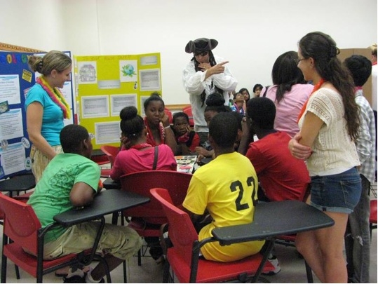 Committee Member Lisa Hoffman and undergraduate Lauren Dire assist Captain Tox