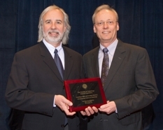 v2Norb Kaminski presents Schnellman with Education Award.jpg