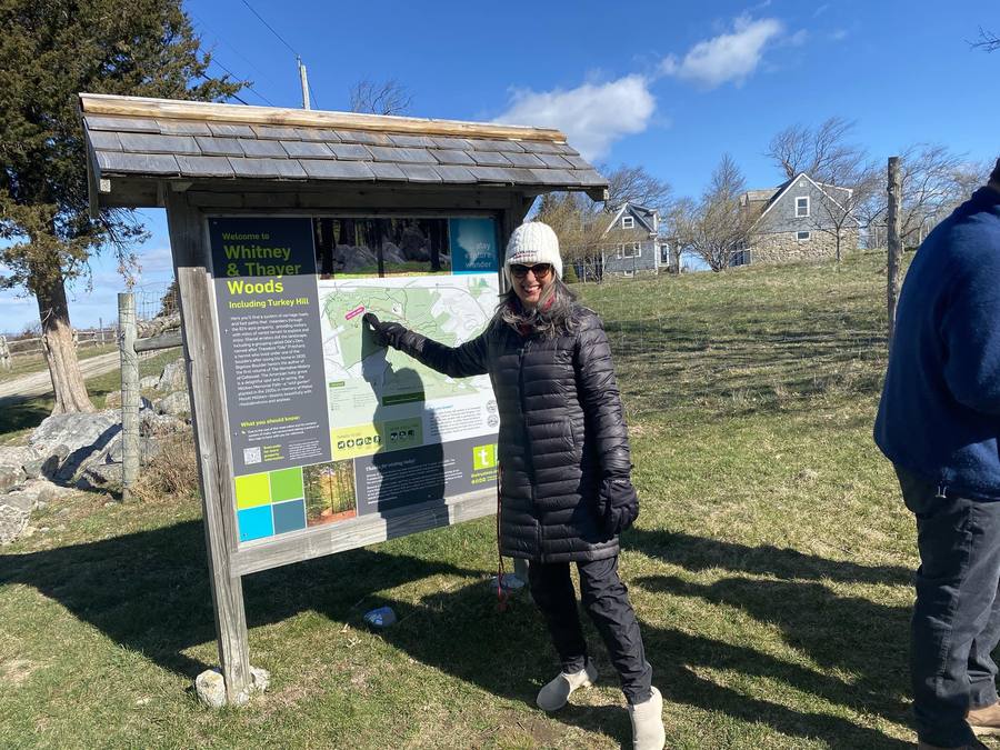A member exploring the Whitney and Thayer Woods trail during a Step Out and Network event