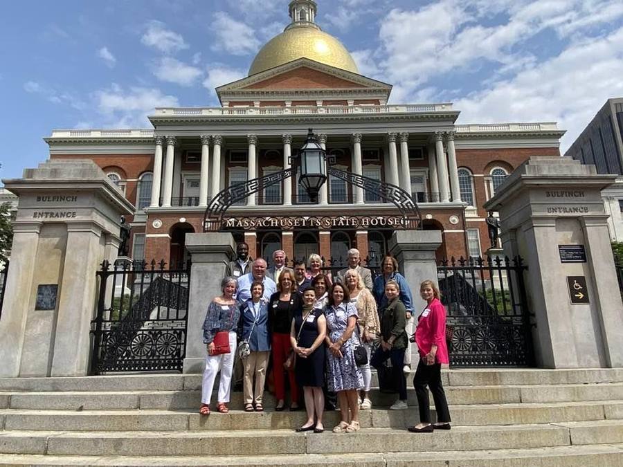 Members posing on the steps of the Massachusetts State House during REALTOR Day on Beacon Hill