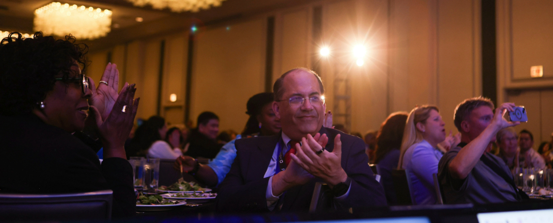 SRAI members applauding award winners at the Annual Meeting