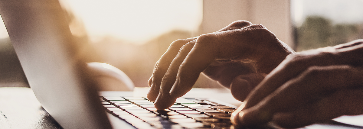 Close up of fingers using a computer keyboard