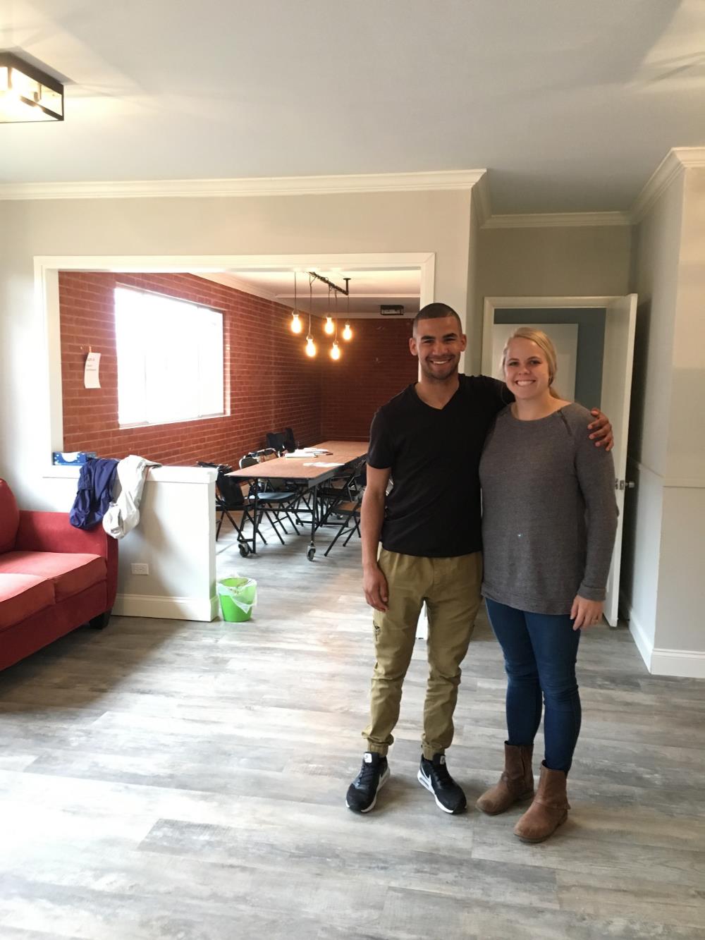 Cove board member Amy Jimenez with former Waco ISD homeless student Danny Tucker in the Cove’s living room.