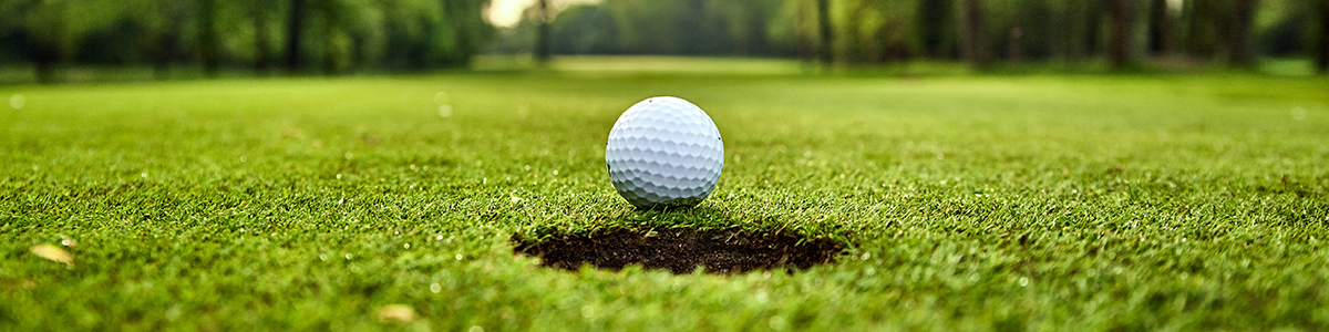 What Do You Do To Unwind? Golf ball about to drop in hole.