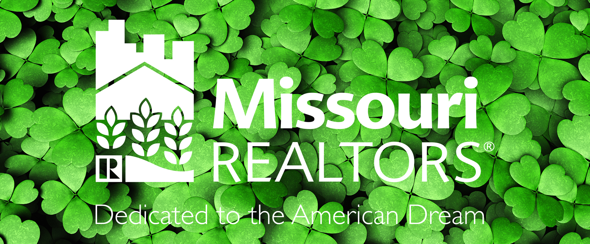 Lucky to be a Missouri REALTORS Expanse of four-leaf clovers with Missouri REALTORS Logo