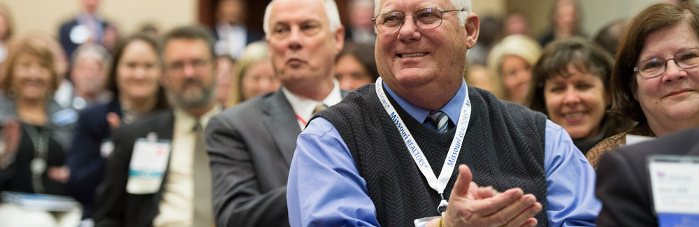 Missouri REALTOR Members Missouri REALTOR Members clapping at a conference