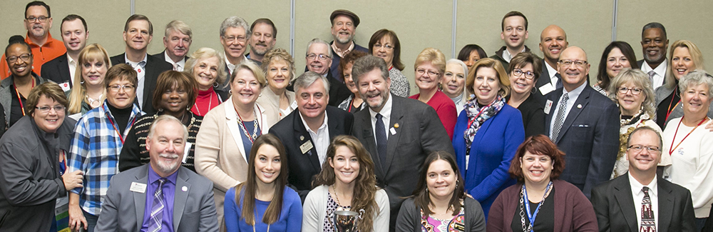 Apply for Scholarship or become a mentor. A group of Missouri REALTORS® smiling for a picture.