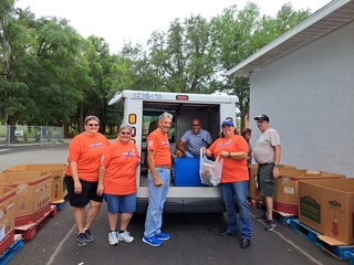 The gang unloading one of the trucks