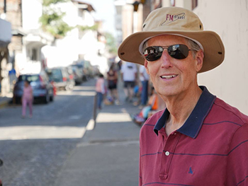 Photo of Glenn on a traveling adventure, courtesy Brian Klinksiek