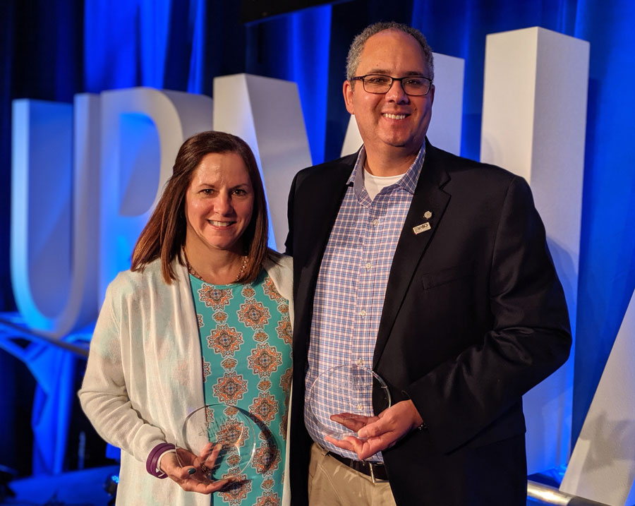 Sandy Mitchell and Samuel Florio hold their DRM awards