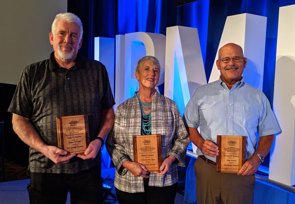 Recipients holding their Emeritus awards